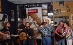 Singing with several friends including Diane Berry, Ben Hall, Charlie Louvin, and Mike Manning